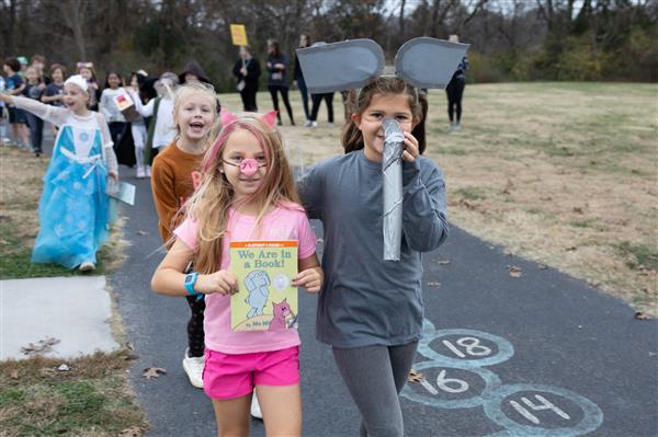 students walking with books